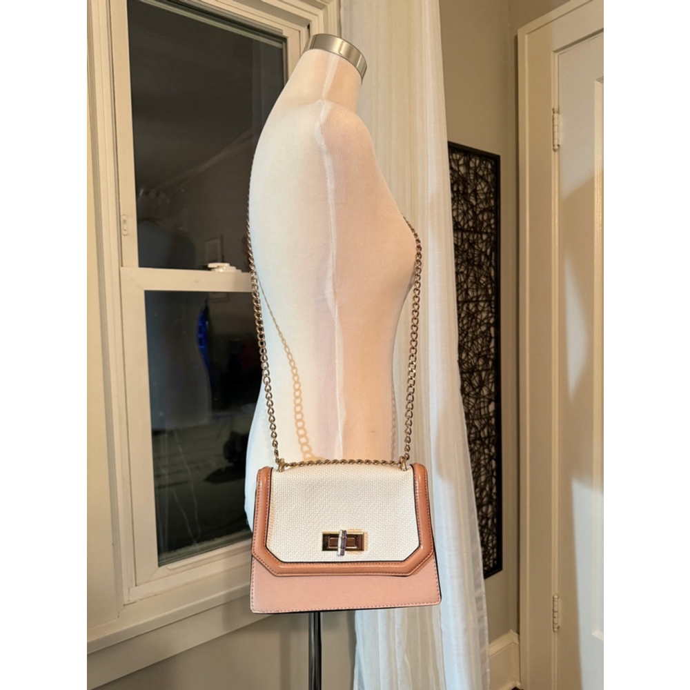Also Crossbody Bag, White & Pink with gold hardware and a chain strap.